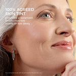 Close-up of a woman's face with a radiant, even complexion from mineral SPF 50 skin tint. Independent study found that 100% agreed that skin tint provided a balanced finish - not too matte or dewy.
